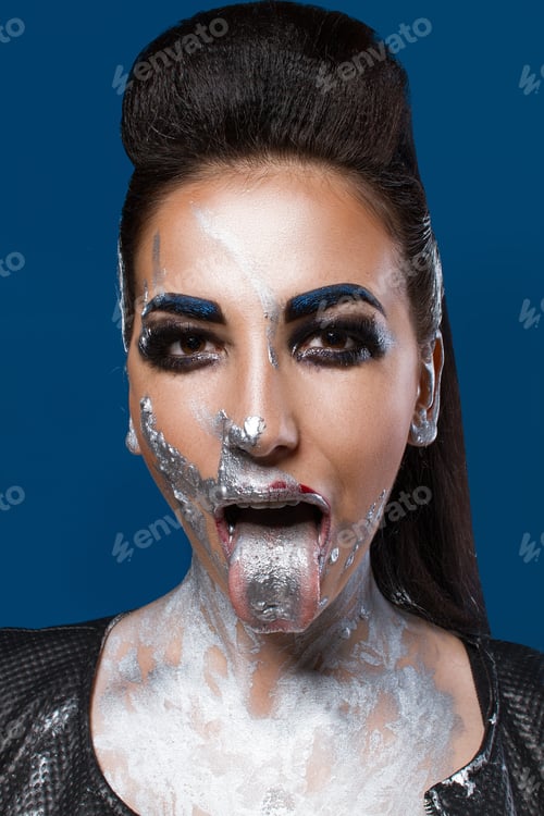 Preview: Girl With Creative Make-Up On A Blue Background