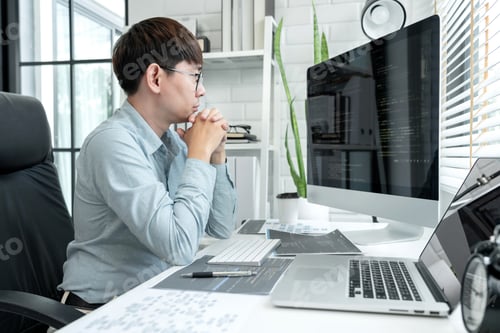 Preview: Male programmer is programing to developing program app and website of corporate while working