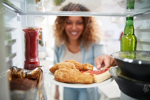 Preview: View Looking Out From Inside Of Refrigerator Filled With Takeaway Food As Woman Opens Door