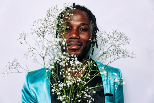 Preview: fine art concept of a man smelling white flowers