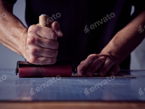 Preview: Crop man working in bookbinding workshop