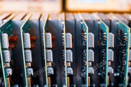 Preview: Close-up electric green embedded microcircuits in production
