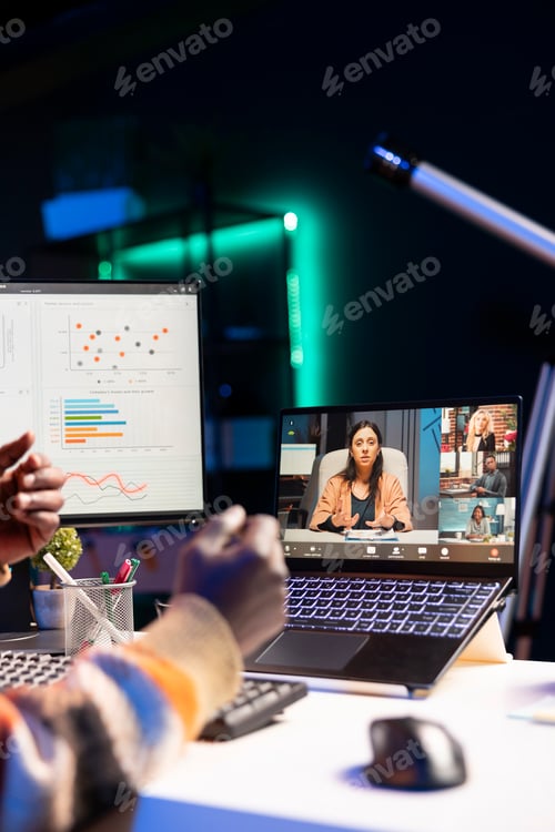Preview: Black man using laptop to participate in online meetings