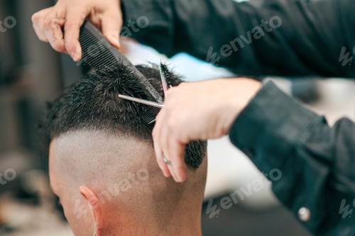 Preview: Anonymous barber cutting hair of unrecognizable client