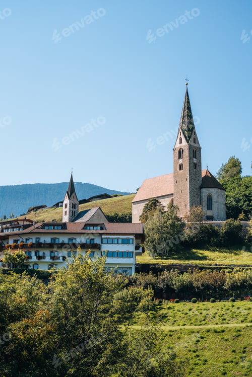 Preview: Church on a mountain overlooking valley in Villandro, Dolomites, Italy