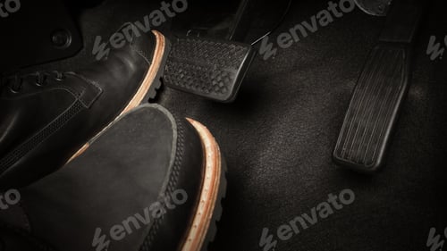 Preview: Close up foot press or push foot break and accelerate pedal of a car to drive ahead.
