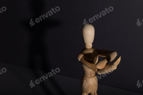 Preview: Wooden mannequin shows obscene gesture fuck off with hands on gray background. protest, riot