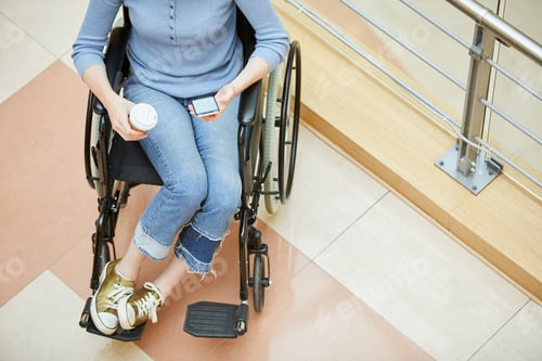 Preview: Disabled woman with coffee and phone