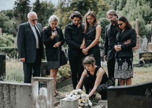 Preview: Family laying flowers on the grave