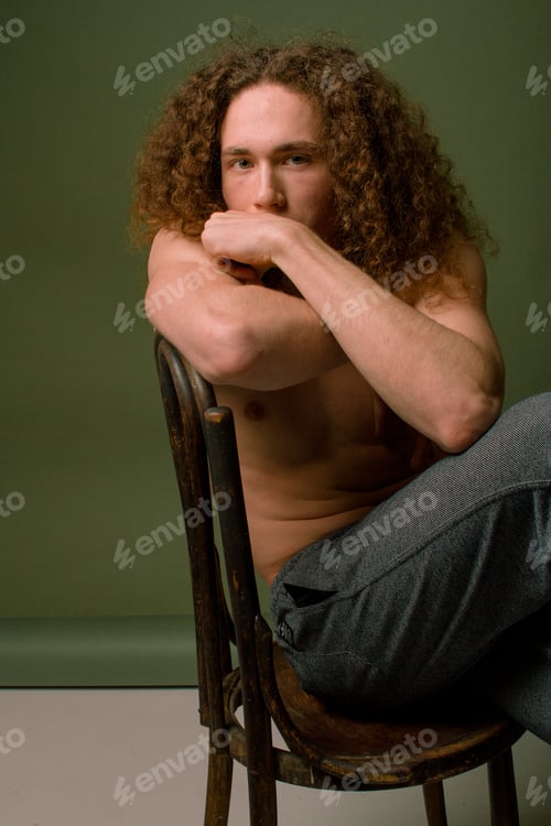 Preview: Attractive And Stylish Guy With Curly Hair And A Sports Figure