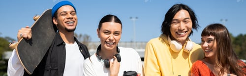 Preview: Young friends share laughter and fun under the bright blue sky in a park setting