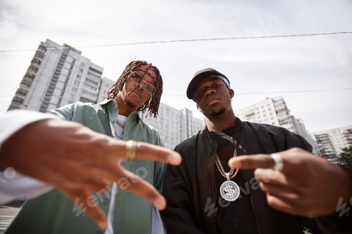 Preview: Focus on two young African American male rappers looking at camera