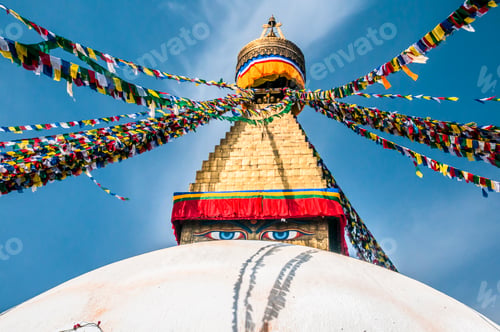 Preview: Colorful Prayer Flags Adorn Boudhanath Stupa Against Blue
