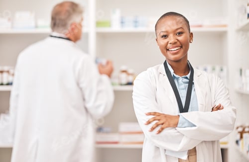 Preview: Confident Woman Pharmacist Smiling in a Pharmacy