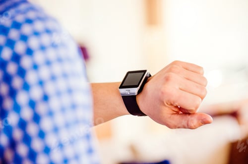 Preview: Close up of unrecognizable man using smart watch