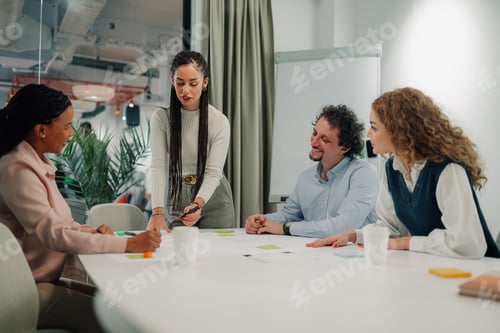 Preview: Diverse team engaging in creative meeting discussion