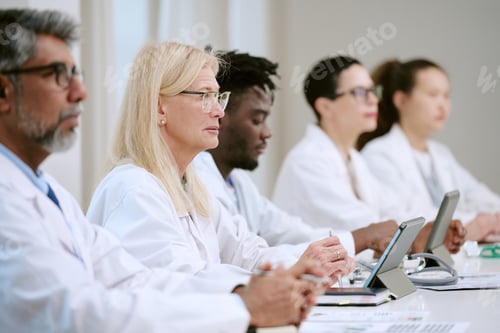 Preview: Diverse Group of Middle Aged Medical Professionals Attending Conference Meeting