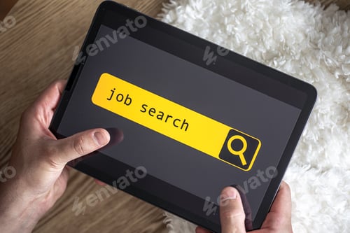 Preview: Top view of digital tablet with search job on screen in male hands.
