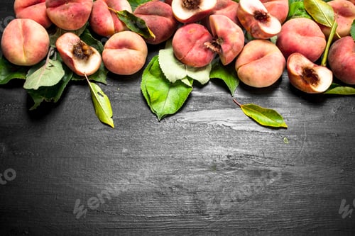 Preview: Ripe peaches with leaves.