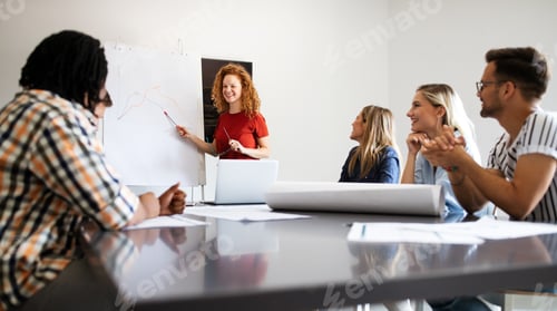 Preview: Successful group of designers, business people at work in office