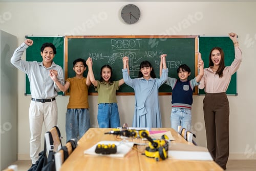 Preview: Portrait of Asian adorable student standing with teachers at school.