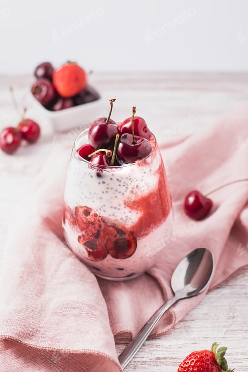 Preview: Yogurt Parfaits with cherry and strawberry on wooden table