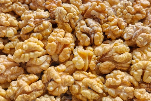 Preview: Close up photo of natural dried walnuts, selective focus, food background.