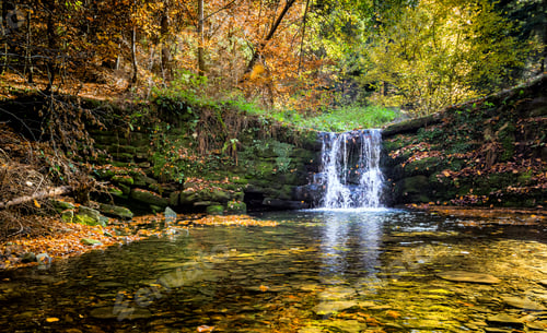 Preview: Beautiful waterfall at the mountain in autumn landscape