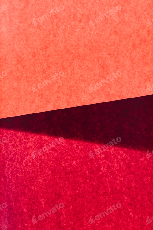 Preview: Overlapping pieces of multicolored construction paper on illuminated backdrop.