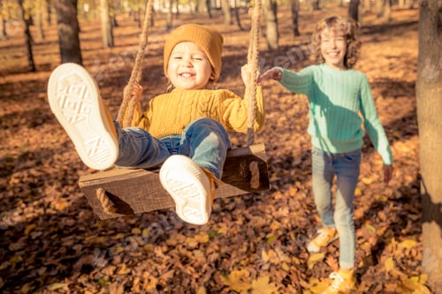 Preview: Happy children having fun outdoor in autumn park