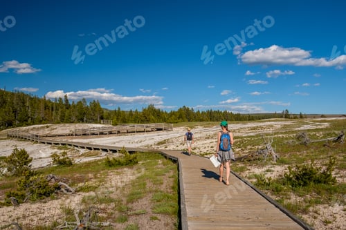 Preview: Tourists With Backpack Hiking In Yellowstone National Park Near Firehole River, Wyoming, Usa
