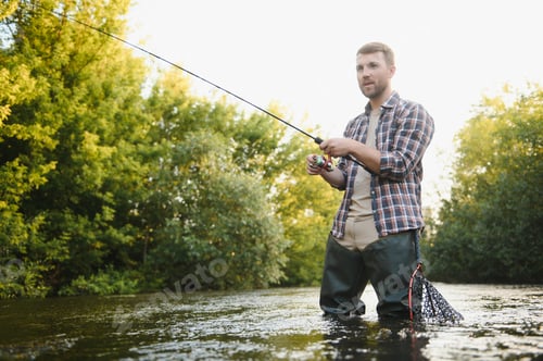 Preview: Man with fishing rod, fisherman men in river water outdoor. Catching trout fish in net.