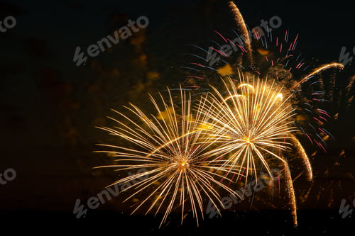Preview: Bright colored fireworks on a festive night. Explosions of colored fire in the sky.