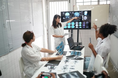 Preview: Group of doctors looking at X-ray on medical conference, discussing issues