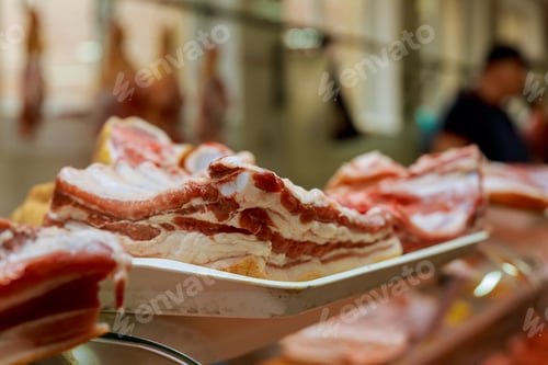 Preview: Production pork meat into pieces for a meat market.