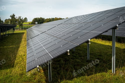 Preview: Solar system panels in the large photovoltaic power plant in the green field