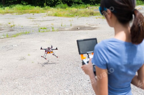 Preview: Woman controling the drone