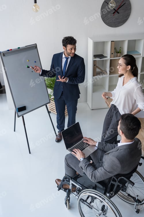 Preview: multicultural businesspeople working on new project together in office