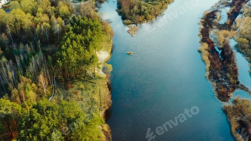 Preview: Aerial View Curved River In Early Spring Landscape. River bends and pine forest landscape. Top View