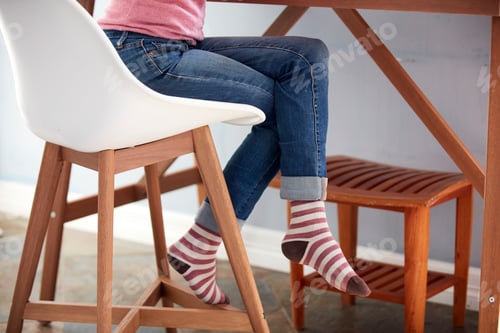Preview: Female legs in jeans and striped socks