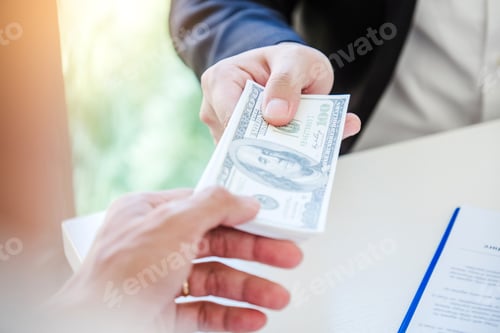 Preview: Corruption concept,Business man passing money dollar bills corruption bribery to businessman manager