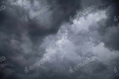 Preview: Low angle greyscale of a dark cloudy sky in the evening - perfect for backgrounds and wallpapers