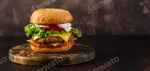 Preview: Close-up of home made tasty burger on wooden table.