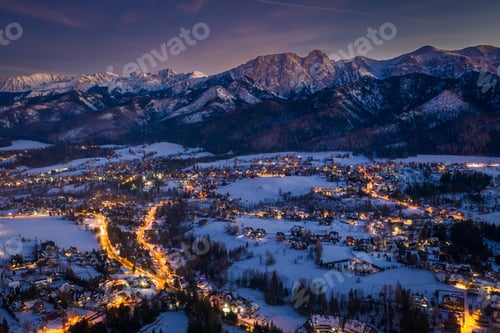 Preview: Stunning illuminated Zakopane city in winter at night, aerial view