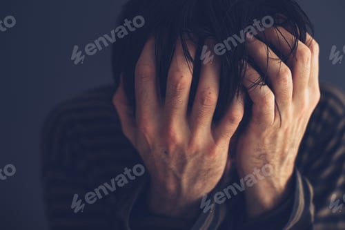 Preview: Hopeless drug addict holding his head