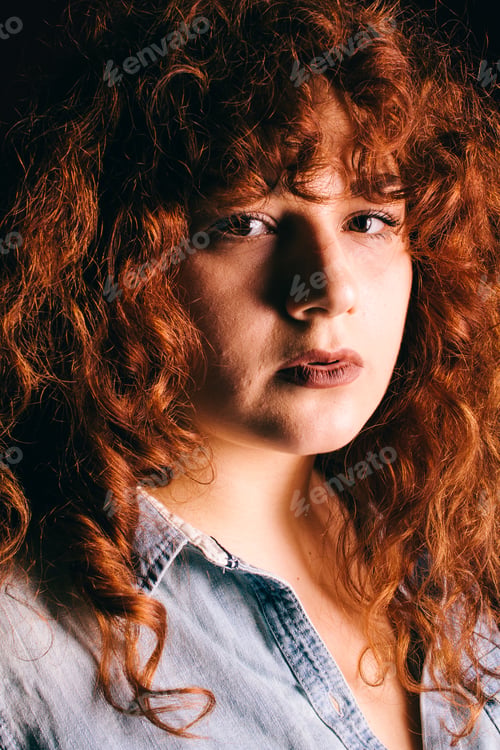 Preview: Portrait Of A Beautiful Girl With Curly Red Hair