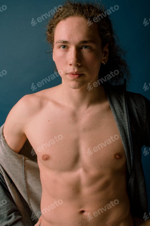 Preview: Attractive And Stylish Guy With Curly Hair And A Sports Figure