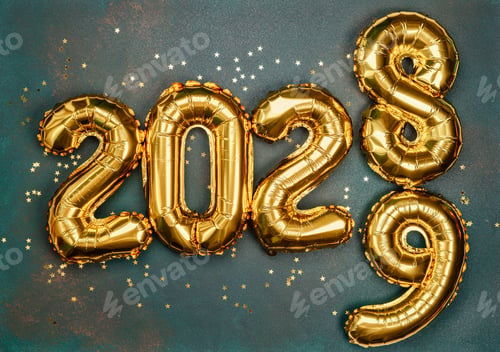 Preview: Celebrating New Year's Eve with golden balloons spelling out the year 2028 and 2029