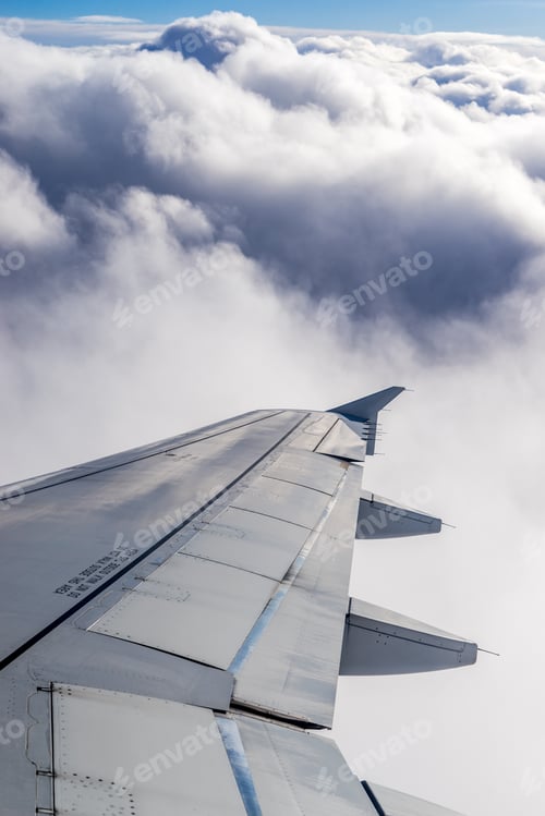 Preview: Wing of an airplane above the clouds