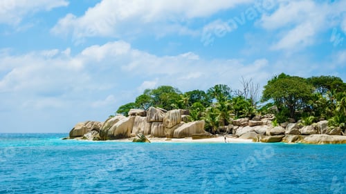 Preview: white tropical beach with huge boulders and palm trees Coco Island Tropical Seychelles Islands